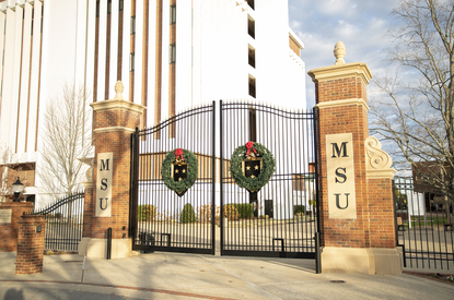 The Murray State campus gates are decorated with holiday wreaths.